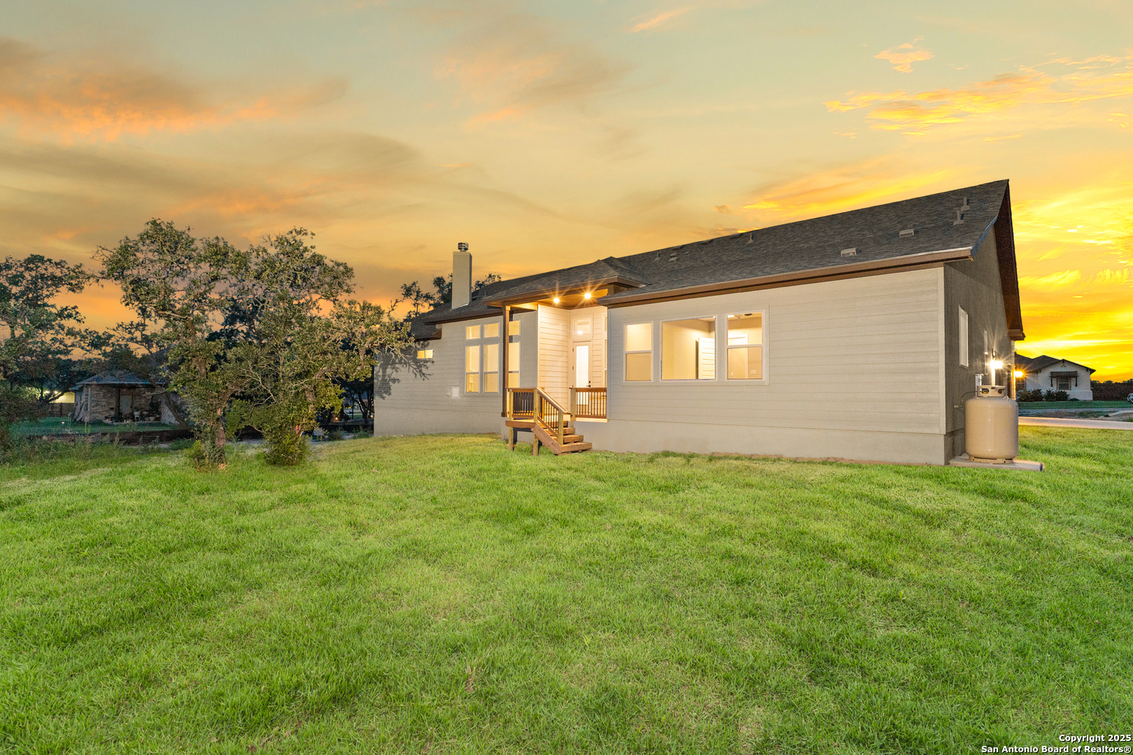 399 James Way Castroville, TX 78009 - Photo 30 of 32 a view of a back yard of the house