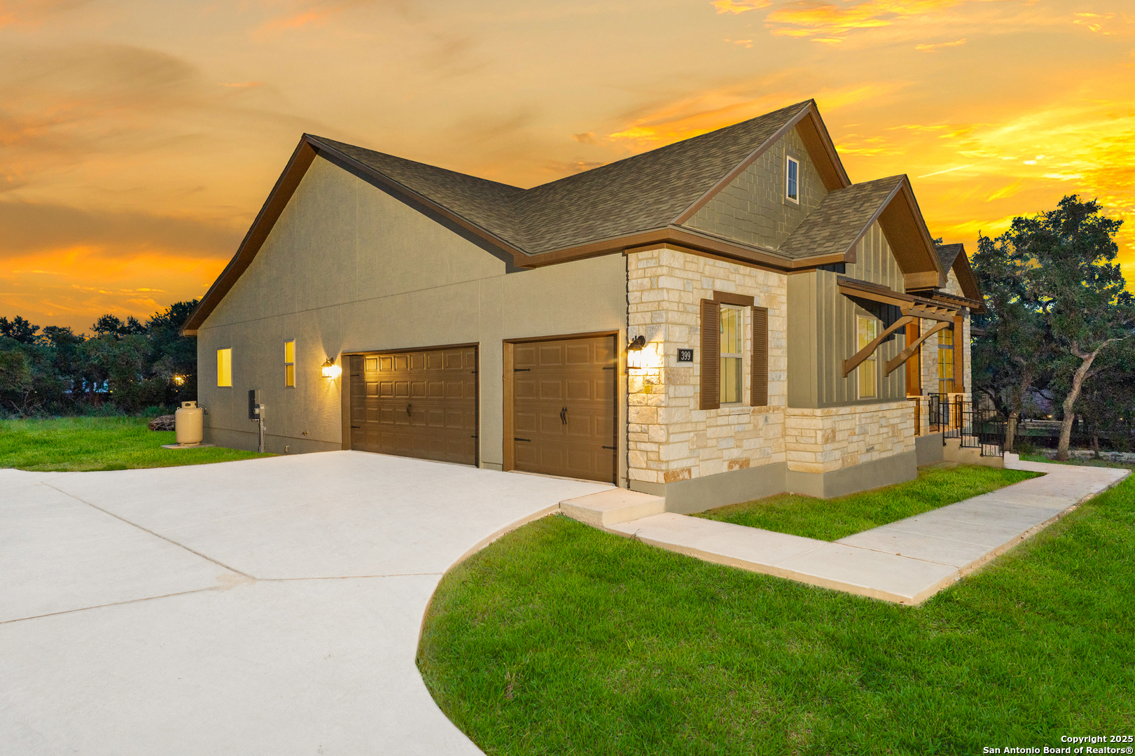 399 James Way Castroville, TX 78009 - Photo 3 of 32 a front view of house with yard and green space