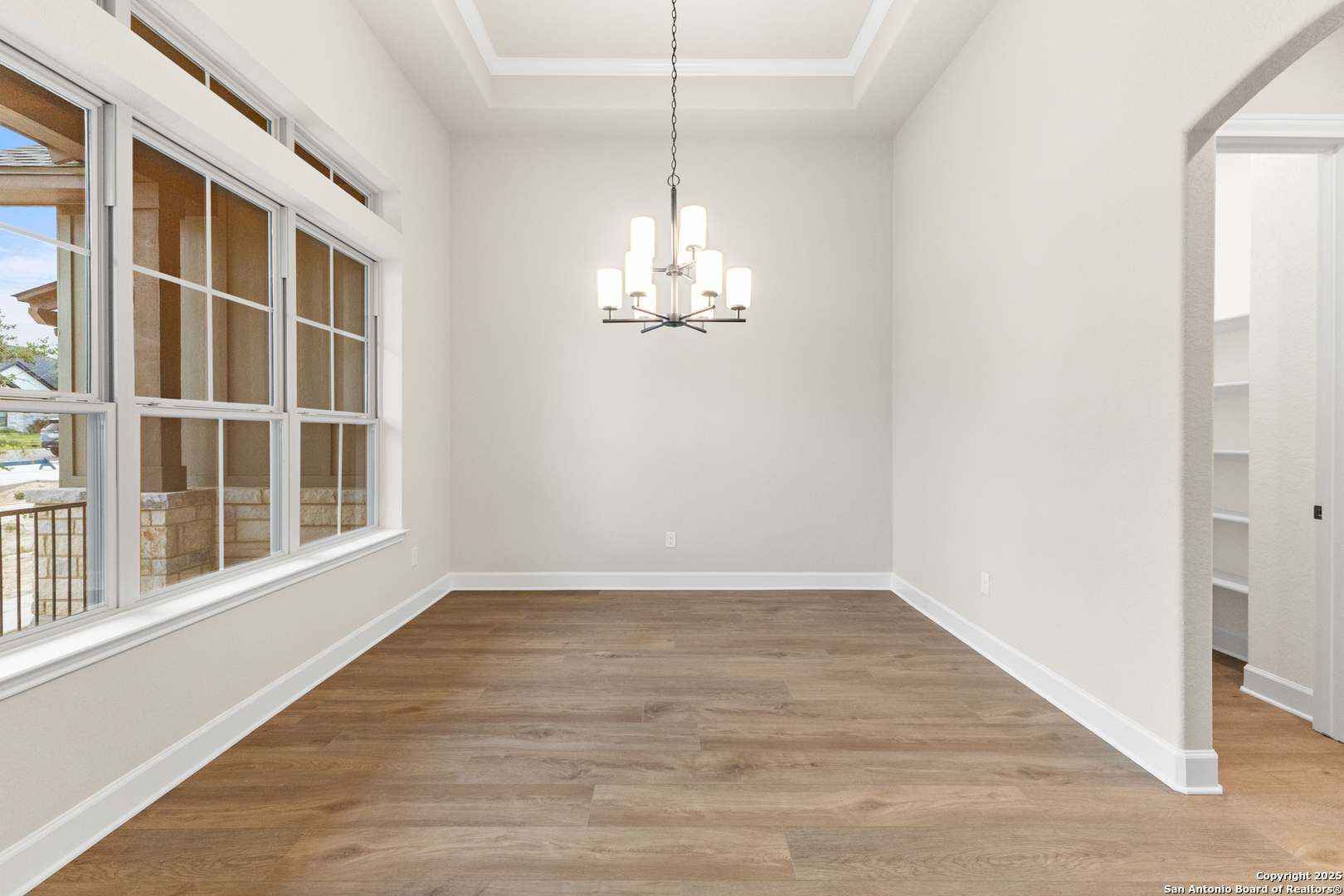 399 James Way Castroville, TX 78009 - Photo 6 of 32 a view of a room with windows