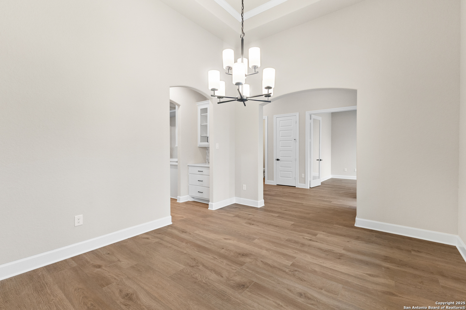 399 James Way Castroville, TX 78009 - Photo 7 of 32 a view of a chandelier in a room