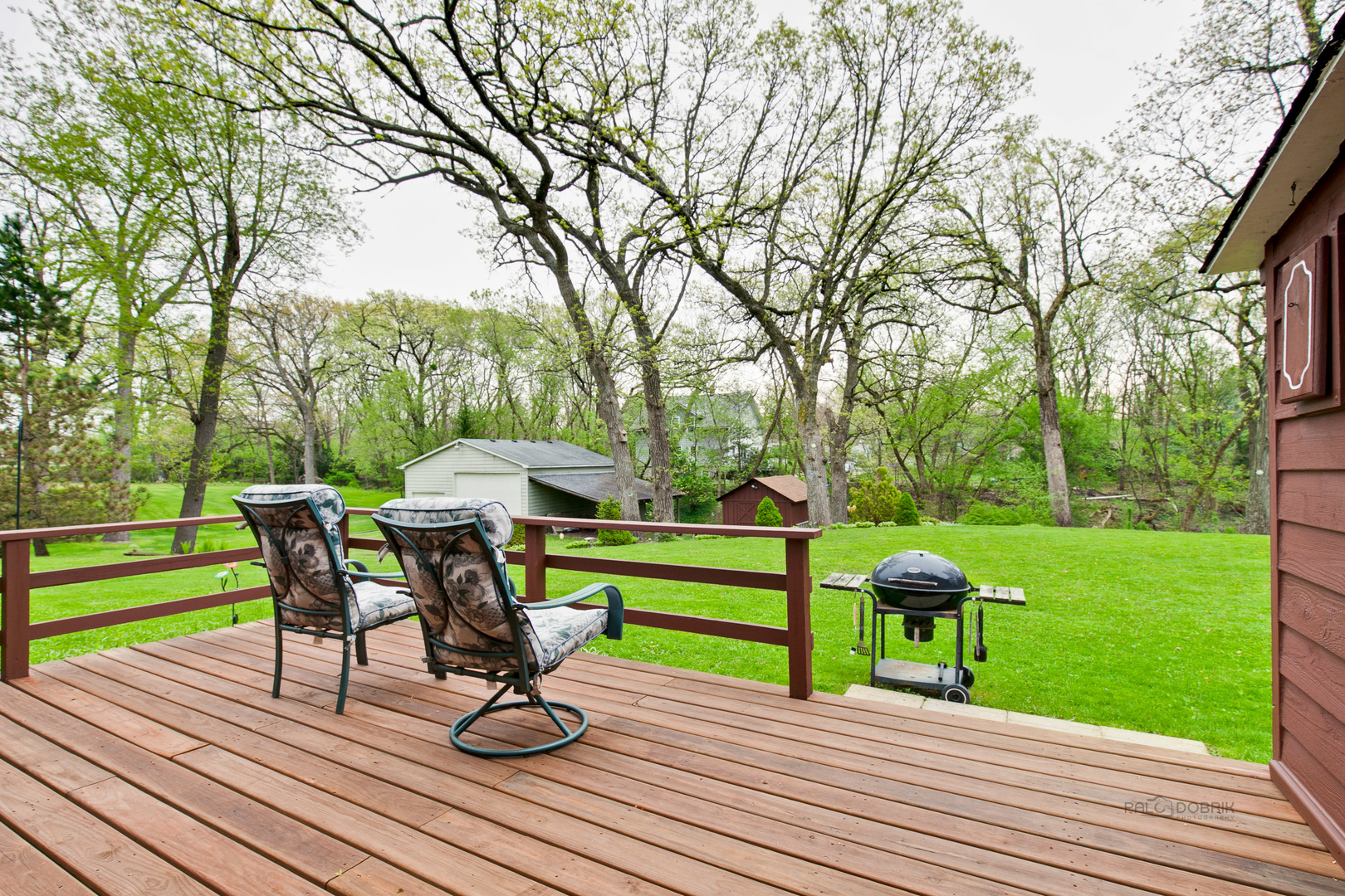 7712 Ravina Drive Spring Grove, IL 60081 - Photo 2 of 30 a view of a deck with furniture and garden