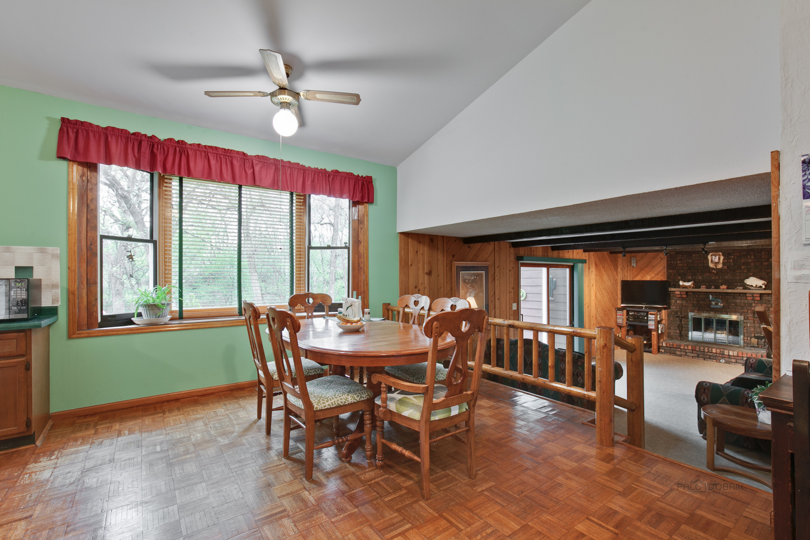 7712 Ravina Drive Spring Grove, IL 60081 - Photo 11 of 30 a view of a dining room with furniture wooden floor and chandelier