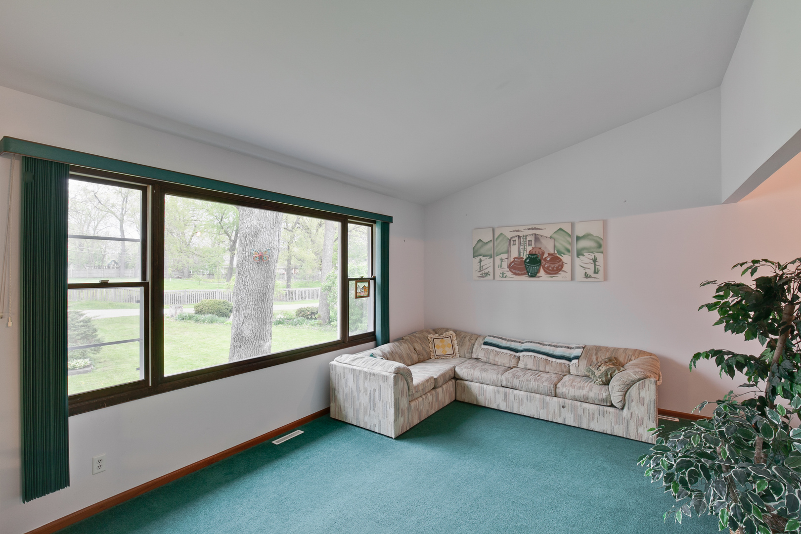 7712 Ravina Drive Spring Grove, IL 60081 - Photo 12 of 30 a room with furniture and a large window