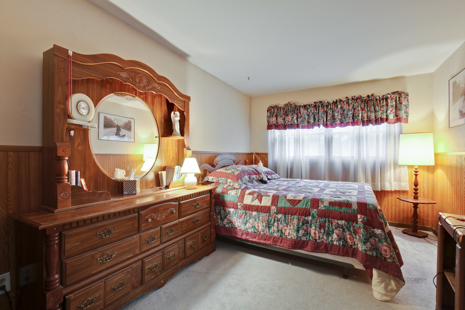7712 Ravina Drive Spring Grove, IL 60081 - Photo 14 of 30 a bedroom with a bed and a dresser
