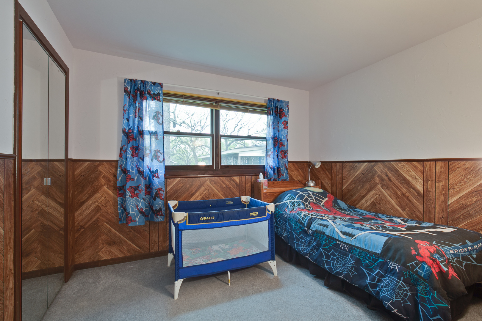 7712 Ravina Drive Spring Grove, IL 60081 - Photo 16 of 30 a bedroom with a bed and a window