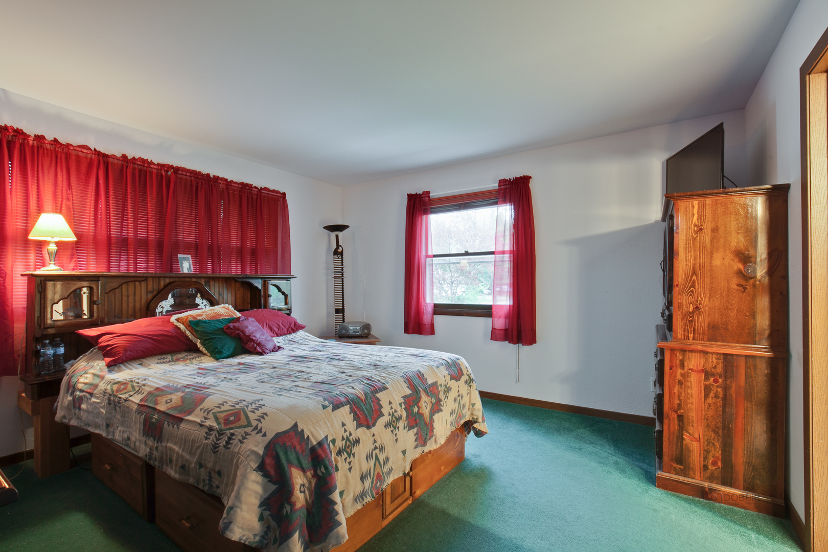 7712 Ravina Drive Spring Grove, IL 60081 - Photo 17 of 30 a bedroom with a bed and a window