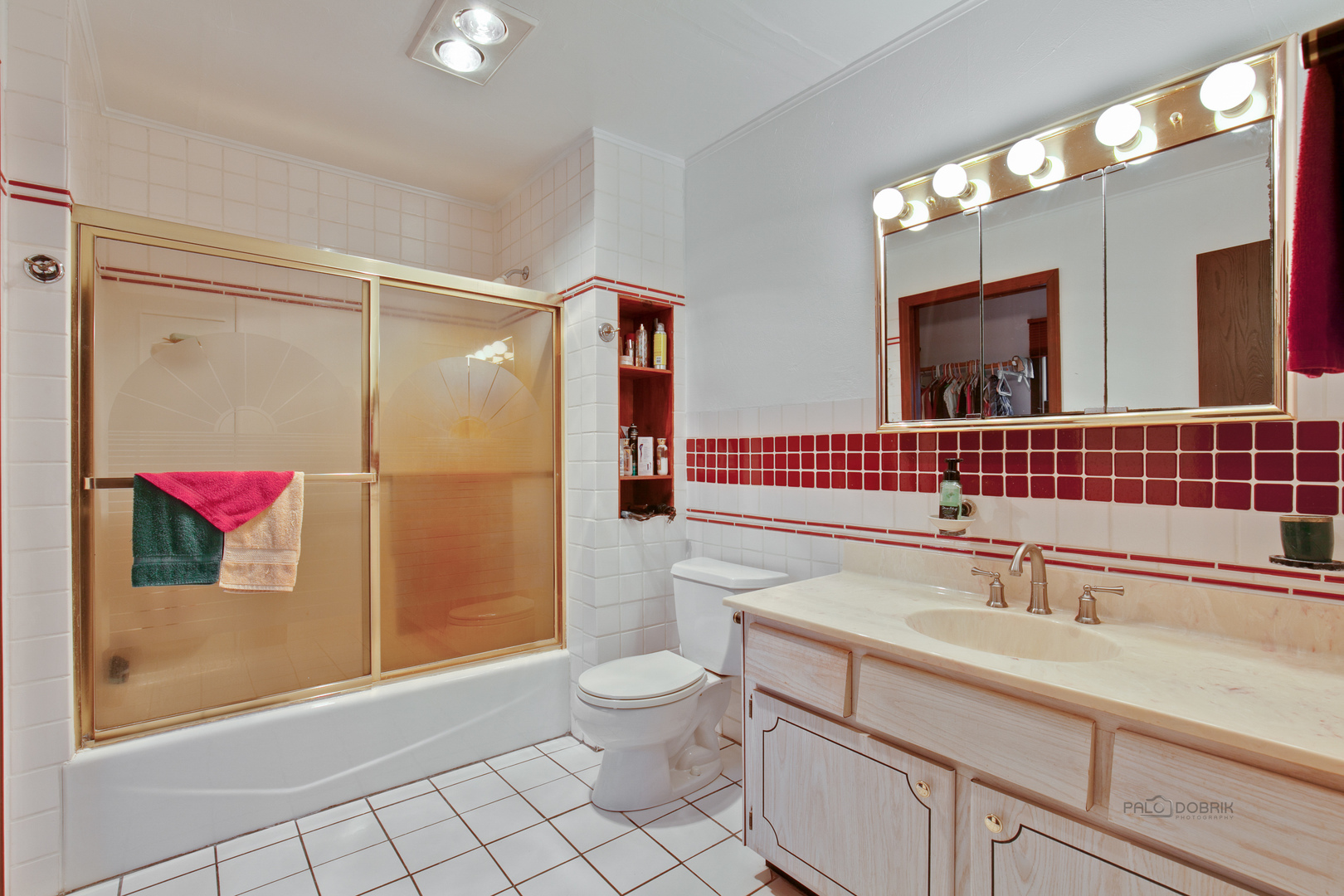 7712 Ravina Drive Spring Grove, IL 60081 - Photo 18 of 30 a bathroom with a sink a toilet and shower