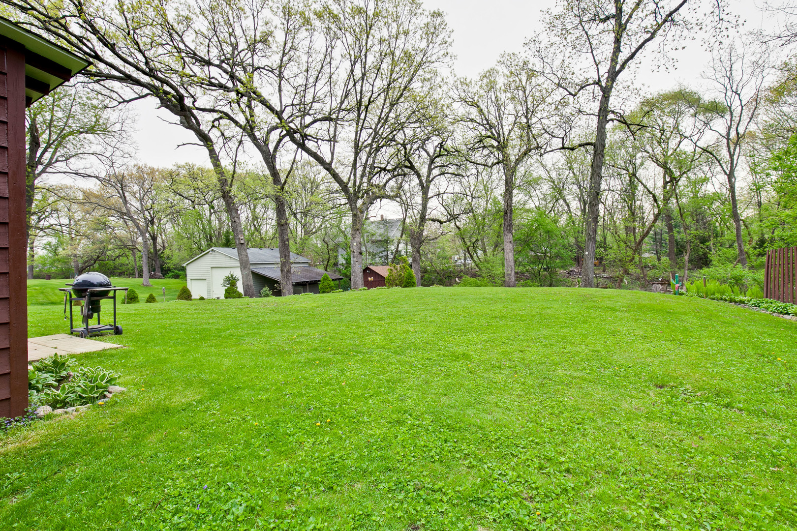 7712 Ravina Drive Spring Grove, IL 60081 - Photo 3 of 30 a view of a garden with trees