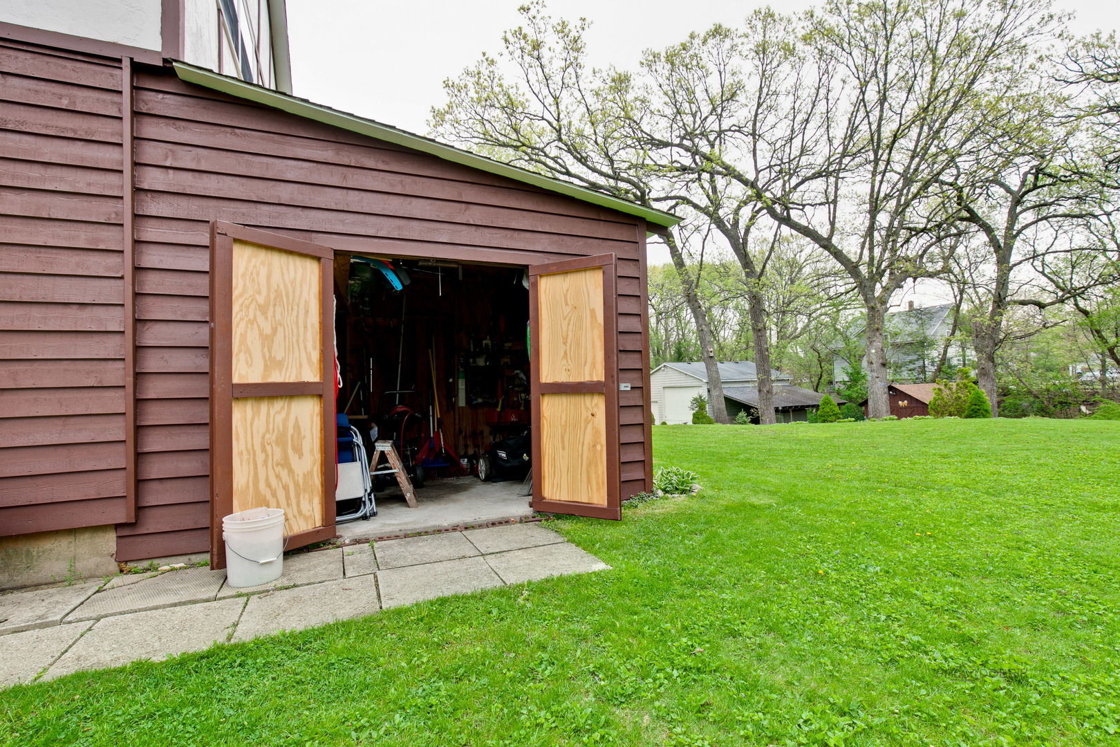 7712 Ravina Drive Spring Grove, IL 60081 - Photo 22 of 30 a view of a bedroom with wooden fence and large trees