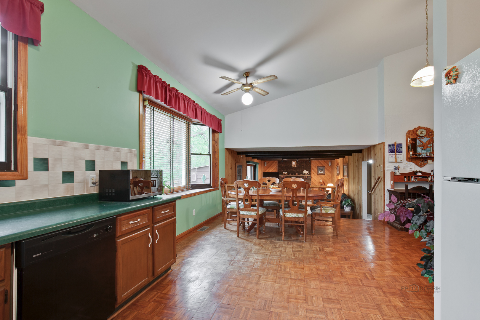 7712 Ravina Drive Spring Grove, IL 60081 - Photo 9 of 30 a group of people sitting in a kitchen