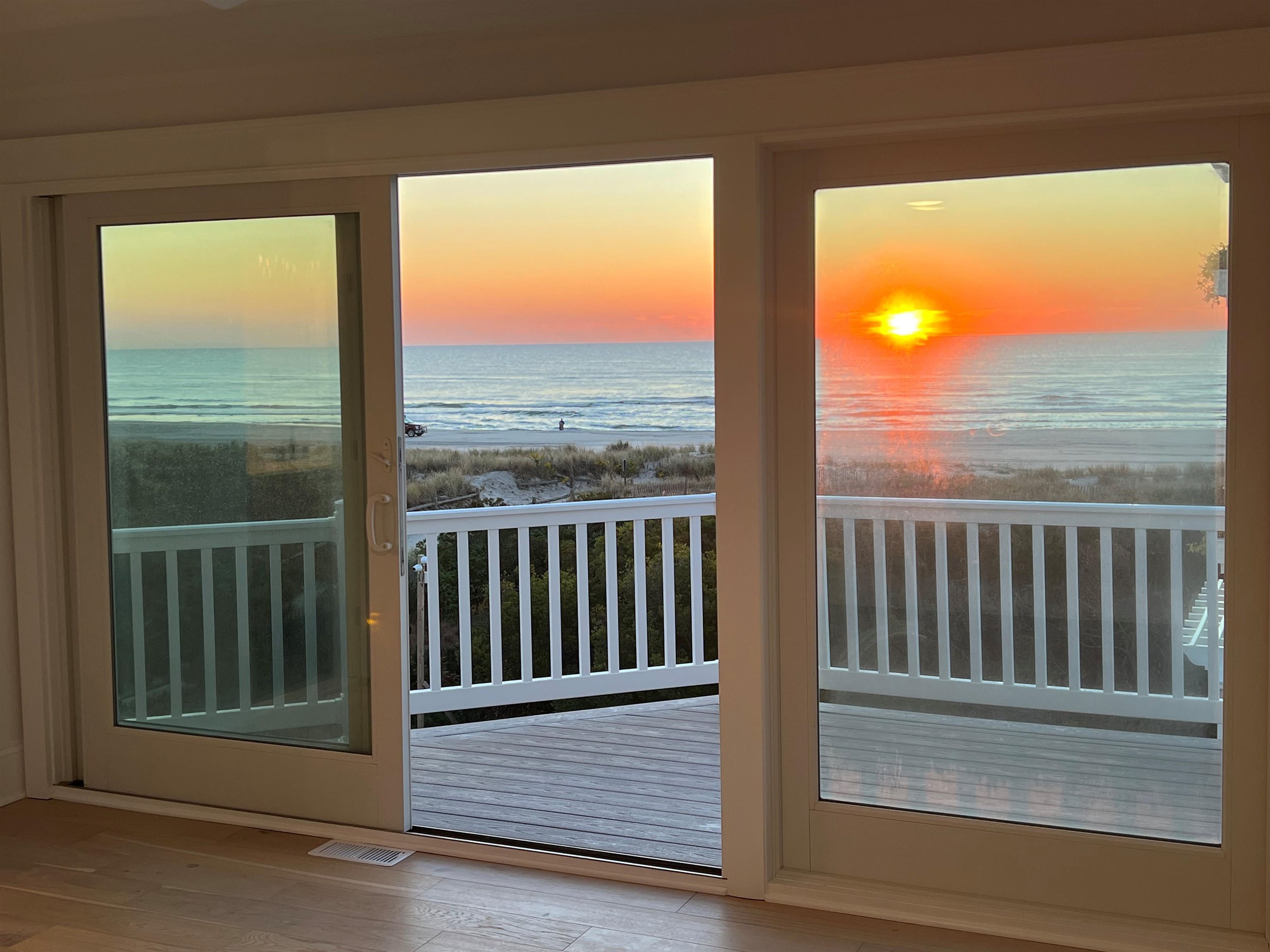2701 Landis Avenue, Unit B SOUTH Sea Isle City, NJ 08243 - Photo 22 of 34 a view of a balcony with floor to ceiling window wooden floor and fence