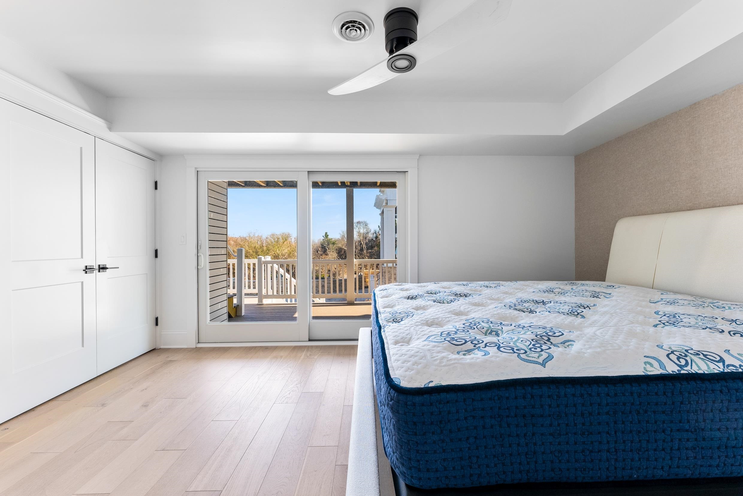 2701 Landis Avenue, Unit B SOUTH Sea Isle City, NJ 08243 - Photo 26 of 34 a bedroom with a bed and a large window with outer view