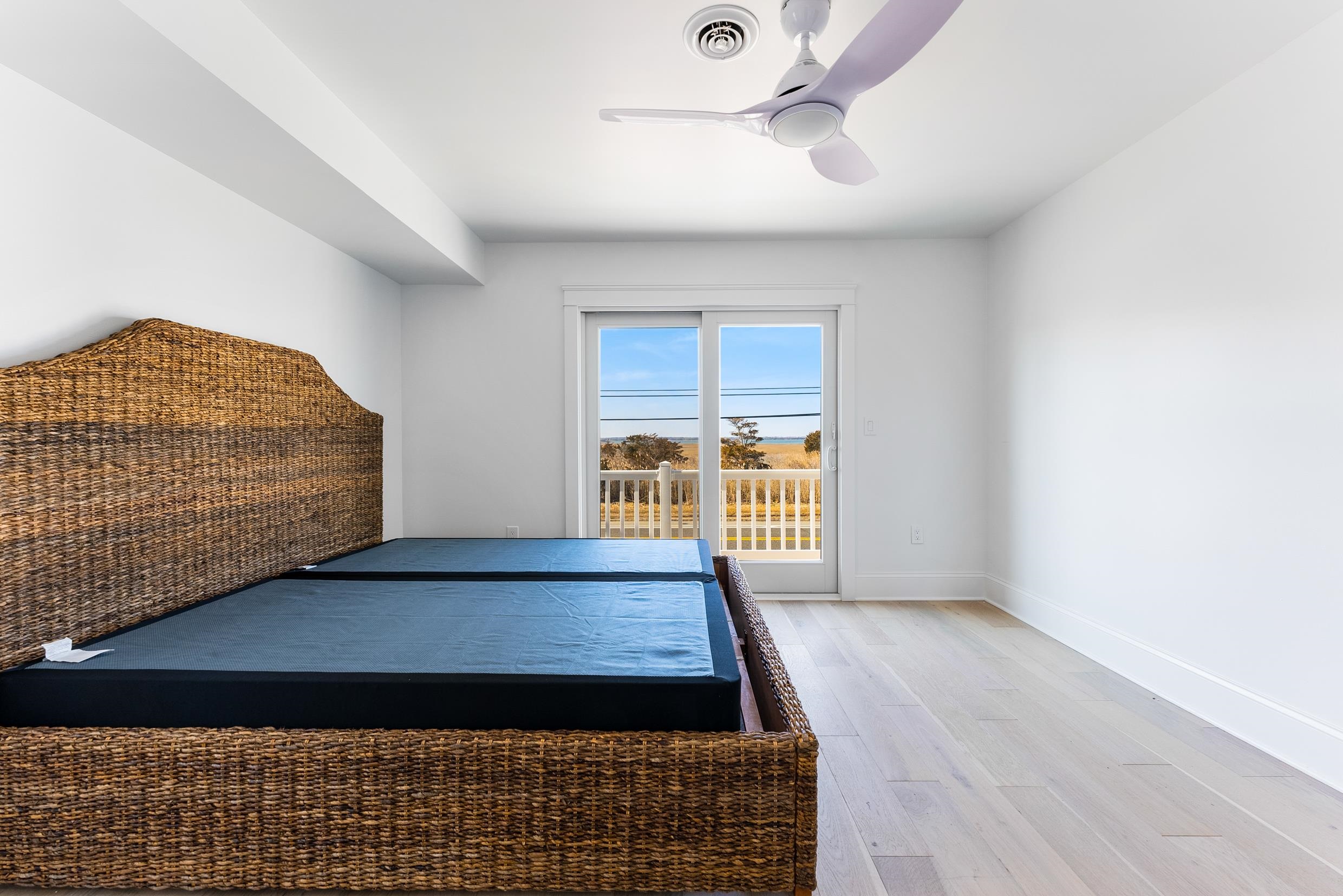 2701 Landis Avenue, Unit B SOUTH Sea Isle City, NJ 08243 - Photo 29 of 34 a view of an empty room with a window and wooden floor