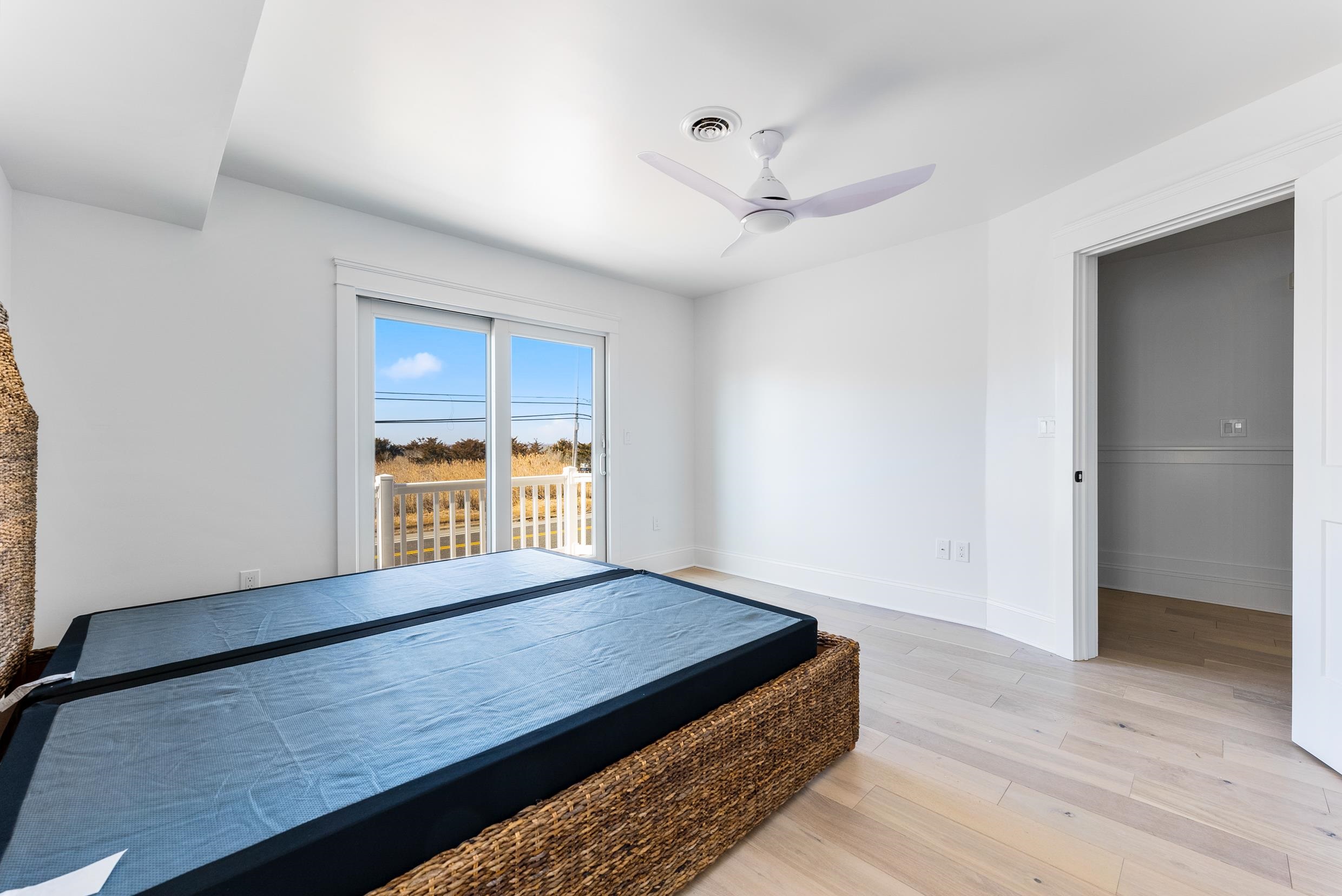 2701 Landis Avenue, Unit B SOUTH Sea Isle City, NJ 08243 - Photo 30 of 34 a view of an empty room with wooden floor and a window