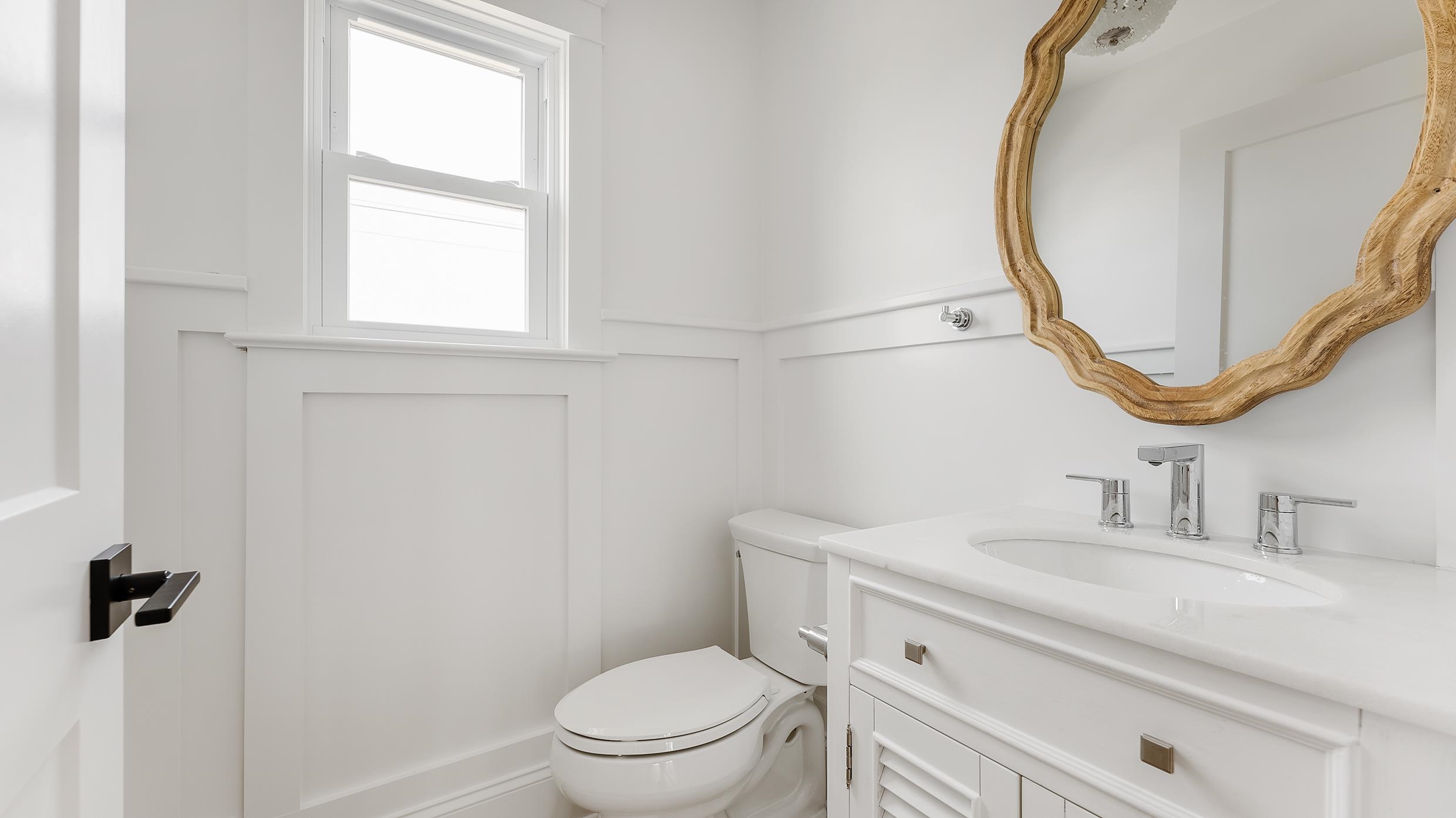 2701 Landis Avenue, Unit B SOUTH Sea Isle City, NJ 08243 - Photo 33 of 34 a bathroom with a sink a toilet and a mirror