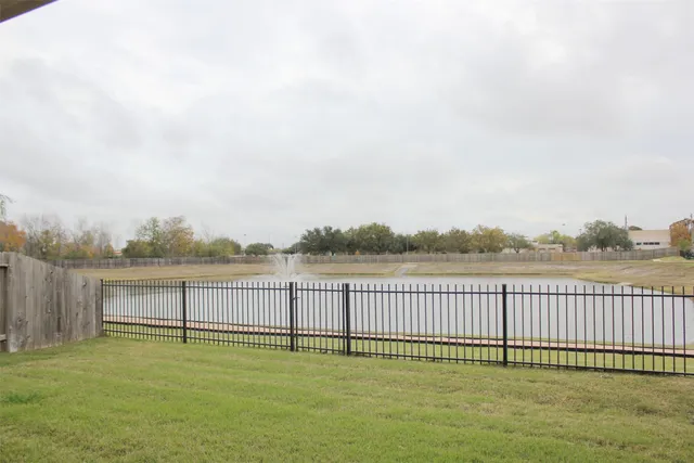 a view of a lake with a yard
