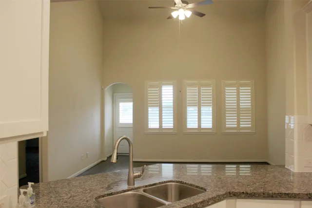 a kitchen with granite countertop a sink and a granite counter tops