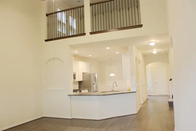 a view of living room with a sink and chandelier