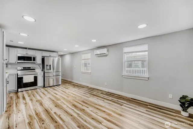 a view of kitchen and wooden floor