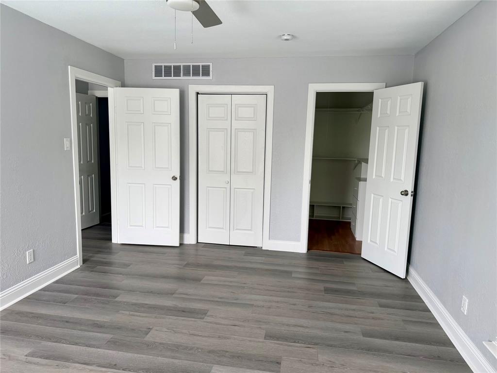12818 Midway Road, Unit 1089 Dallas, TX 75244 - Photo 13 of 18 a view of empty room with wooden floor