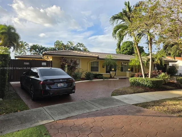 a car parked in front of a house
