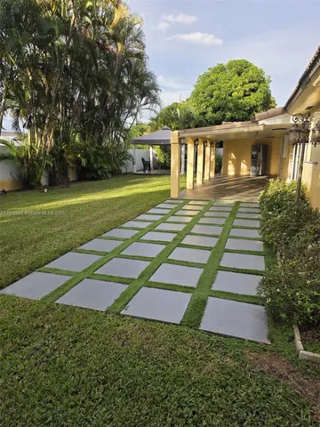 a backyard of a house with lots of green space