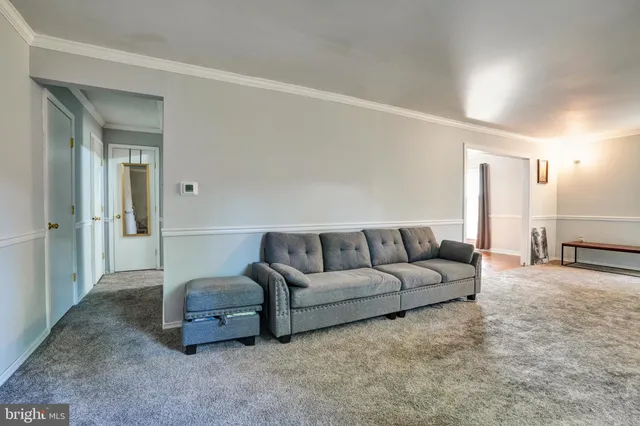 a living room with furniture and a couch