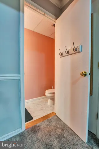 a bathroom with a granite countertop shower and a toilet