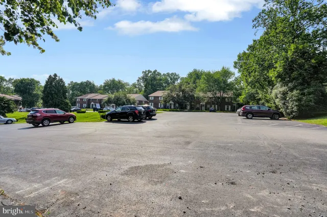 a view of street with parked cars