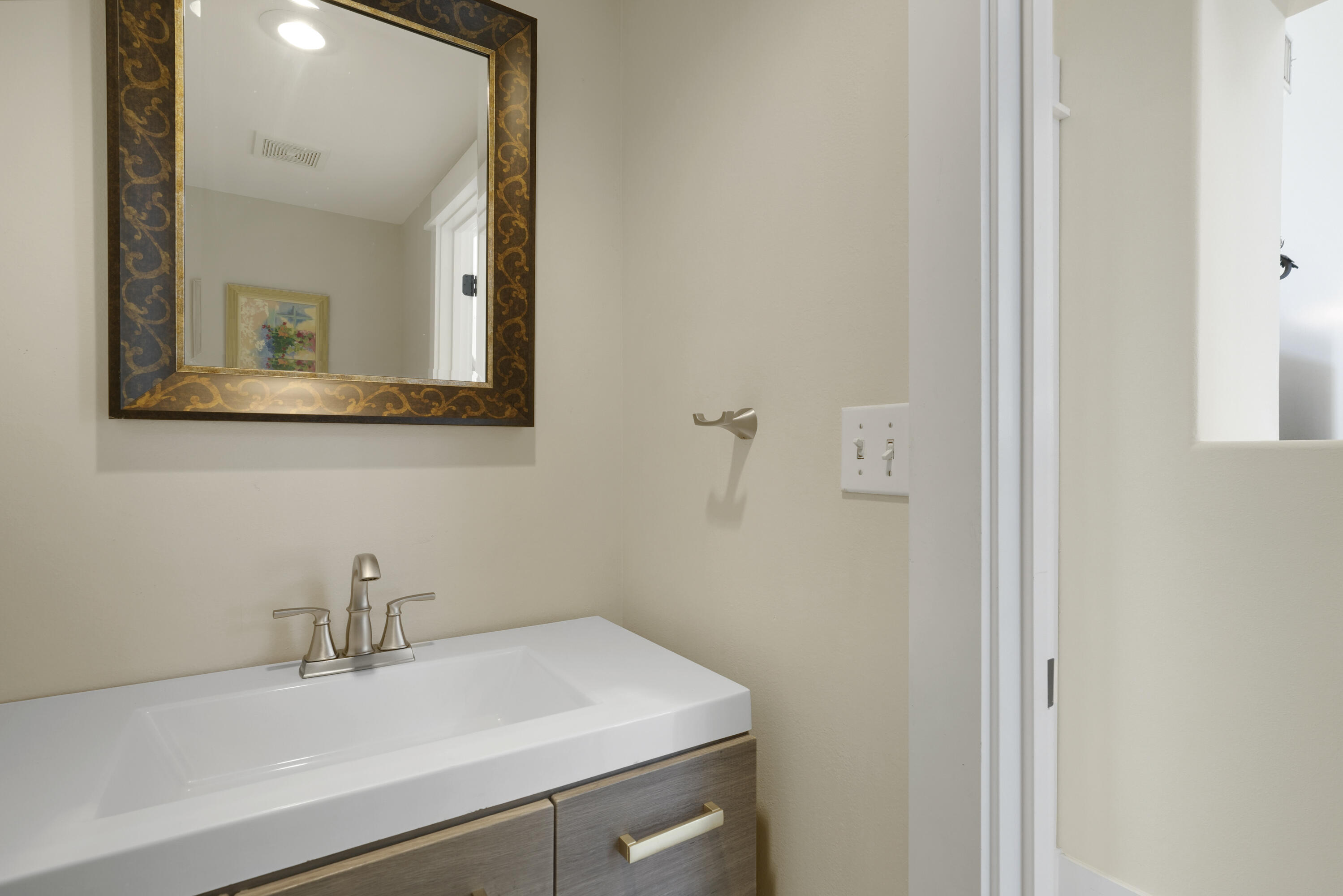 8026 Legend Creek Dr. Miramar Beach, FL 32550 - Photo 26 of 88 a bathroom with a sink and a mirror