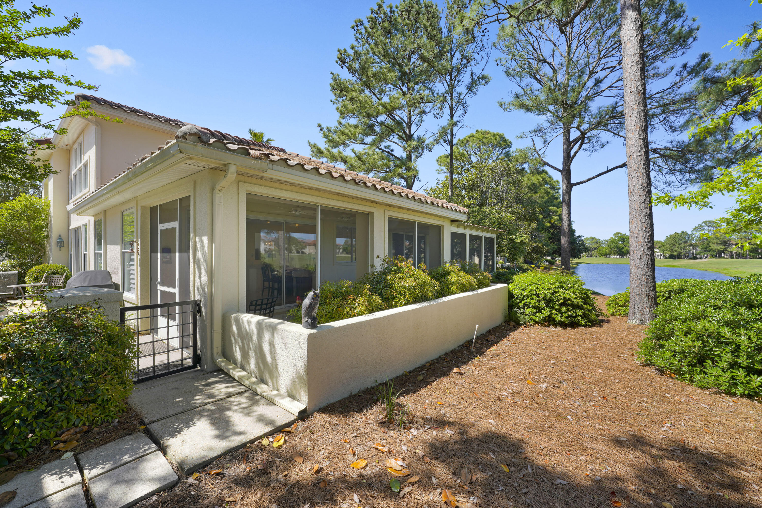 8026 Legend Creek Dr. Miramar Beach, FL 32550 - Photo 32 of 88 a view of a house with a yard and potted plants