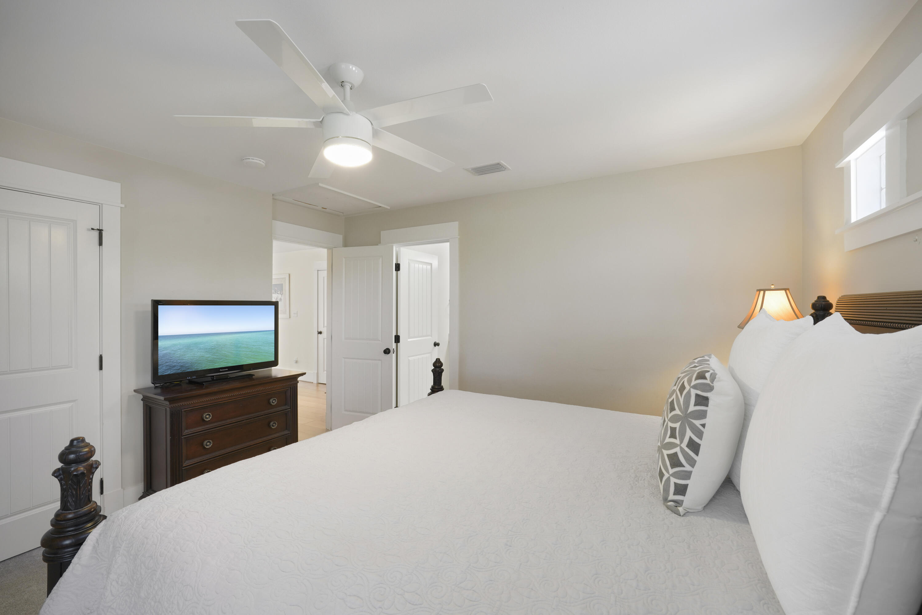 8026 Legend Creek Dr. Miramar Beach, FL 32550 - Photo 39 of 88 a bedroom with a bed and a flat tv screen on dresser