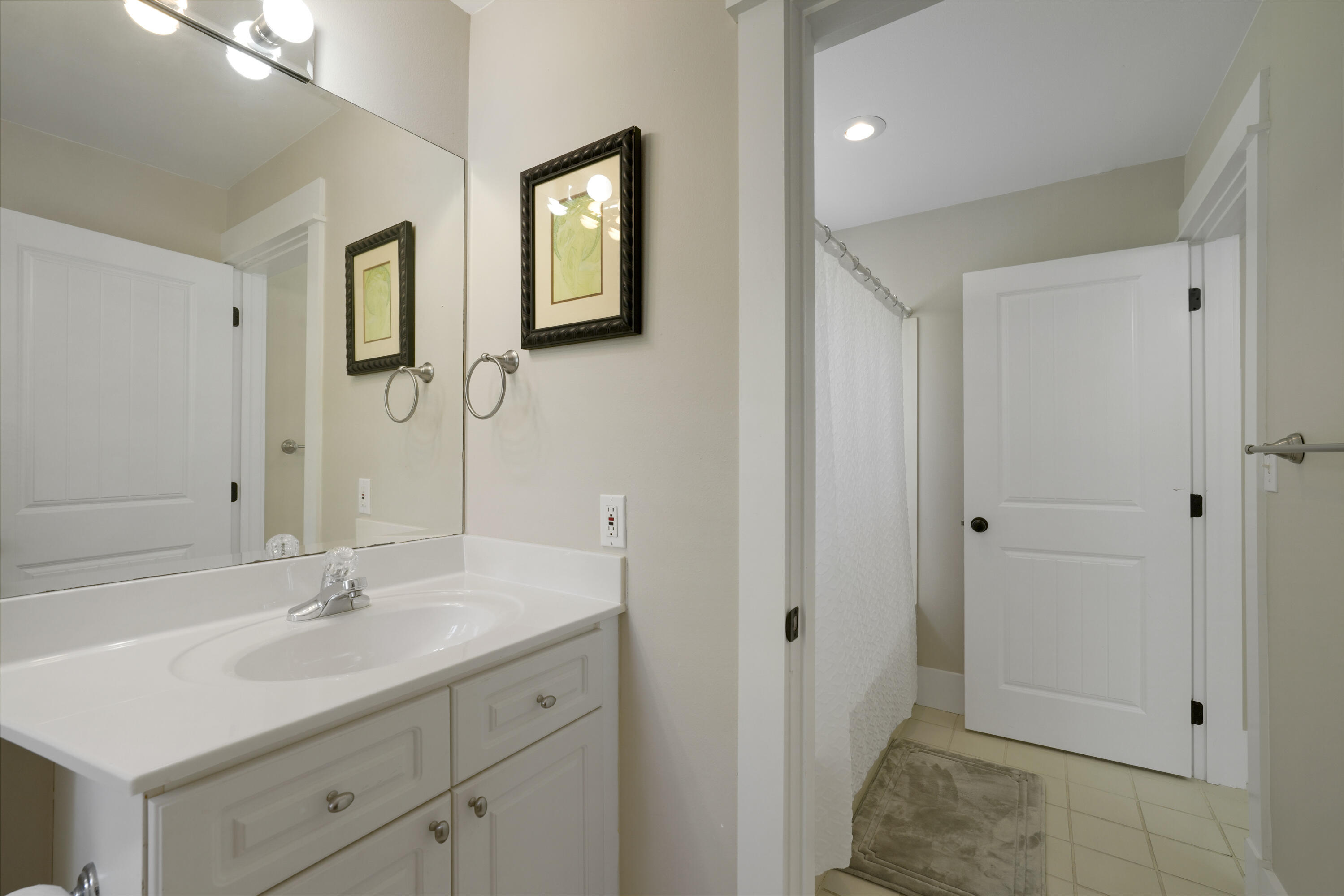 8026 Legend Creek Dr. Miramar Beach, FL 32550 - Photo 41 of 88 a bathroom with a sink a light fixture and a mirror