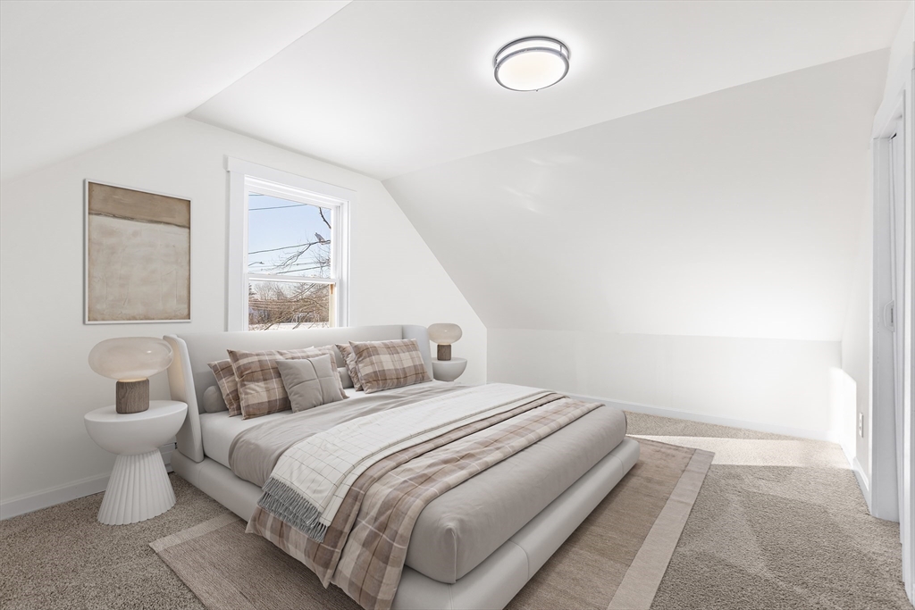 26 River Street Billerica, MA 01821 - Photo 10 of 10 a bedroom with a bed and a large window