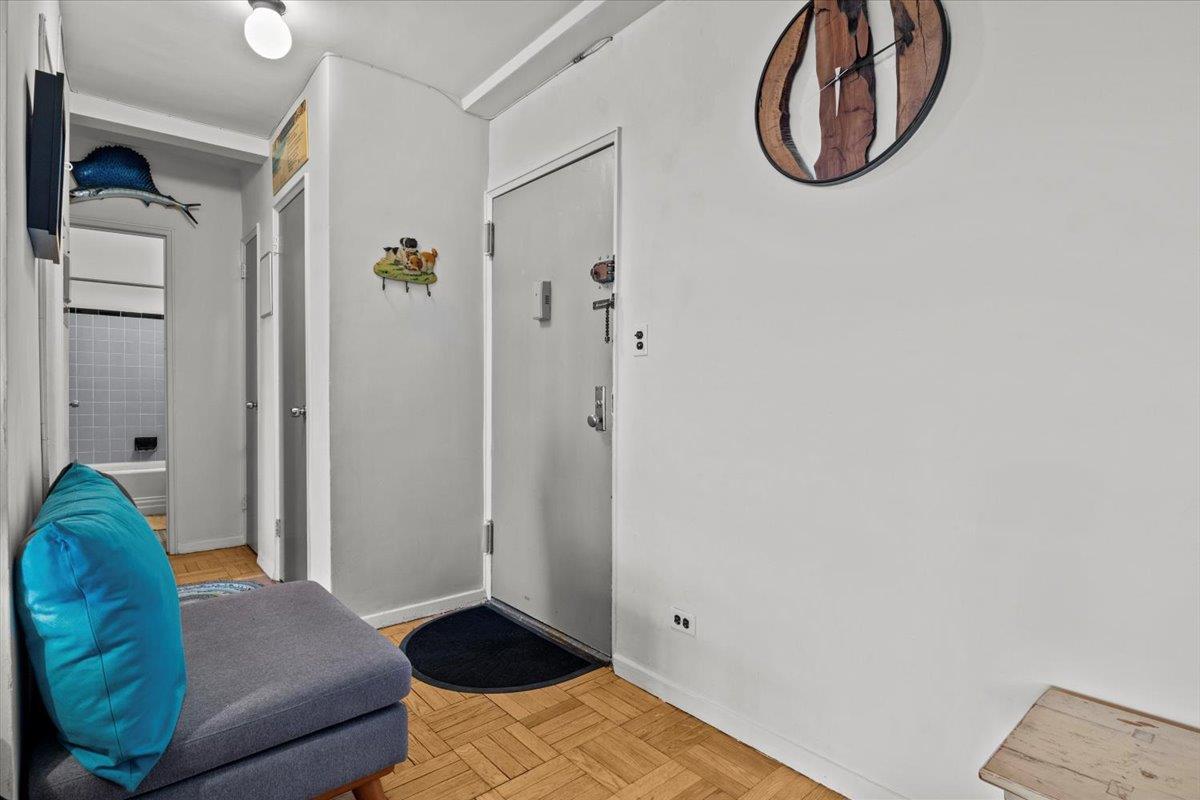 5550 Fieldston Road, Unit 7C Bronx, NY 10471 - Photo 17 of 26 a bedroom with a bed and a shower