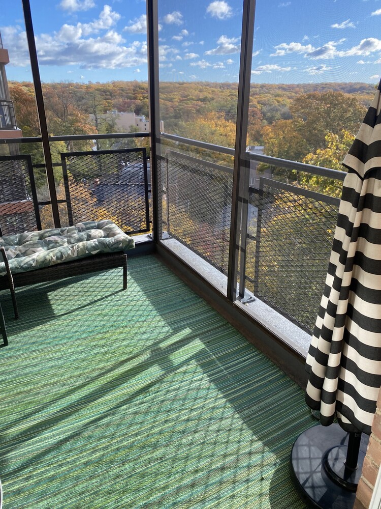 5550 Fieldston Road, Unit 7C Bronx, NY 10471 - Photo 2 of 26 a view of a balcony with floor to ceiling windows with wooden floor