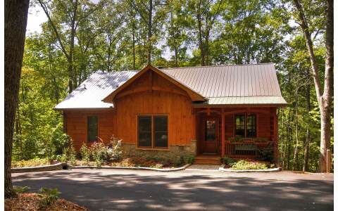 1128 Maggie Chapman Road Blue Ridge, GA 30513 - Photo 1 of 1 a front view of a house with a yard