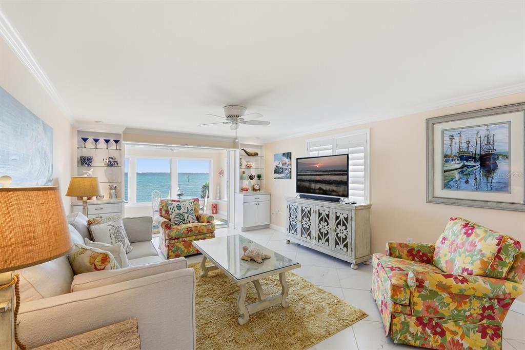 957 Spanish Drive North Longboat Key, FL 34228 - Photo 11 of 37 a living room with furniture and a flat screen tv