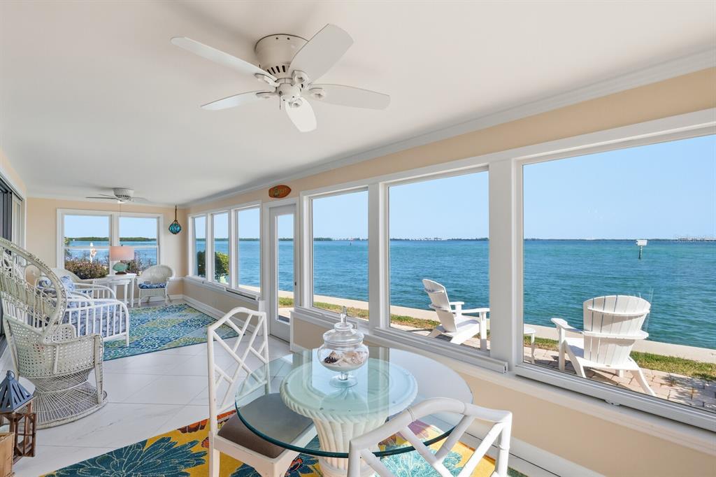 957 Spanish Drive North Longboat Key, FL 34228 - Photo 13 of 37 a living room with furniture and a large window