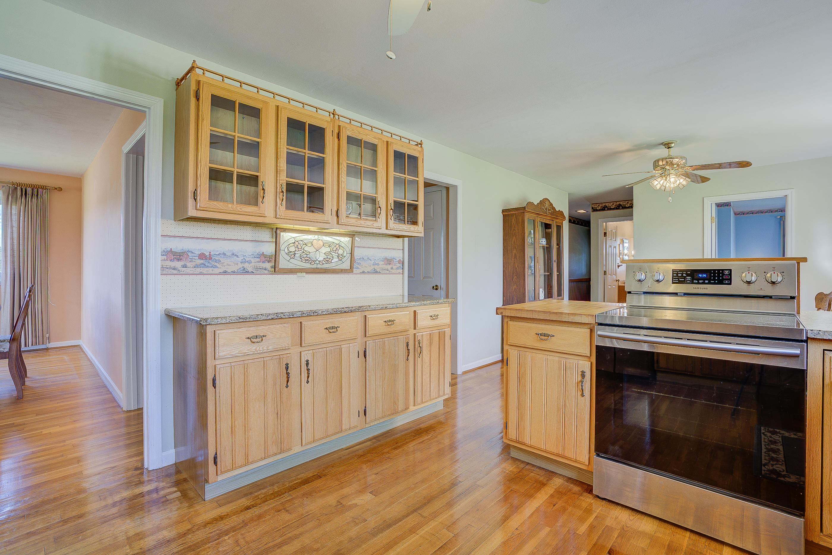 1311 Rock Spring Road Goodview, VA 24095 - Photo 18 of 54 a kitchen with stainless steel appliances granite countertop a stove and a sink