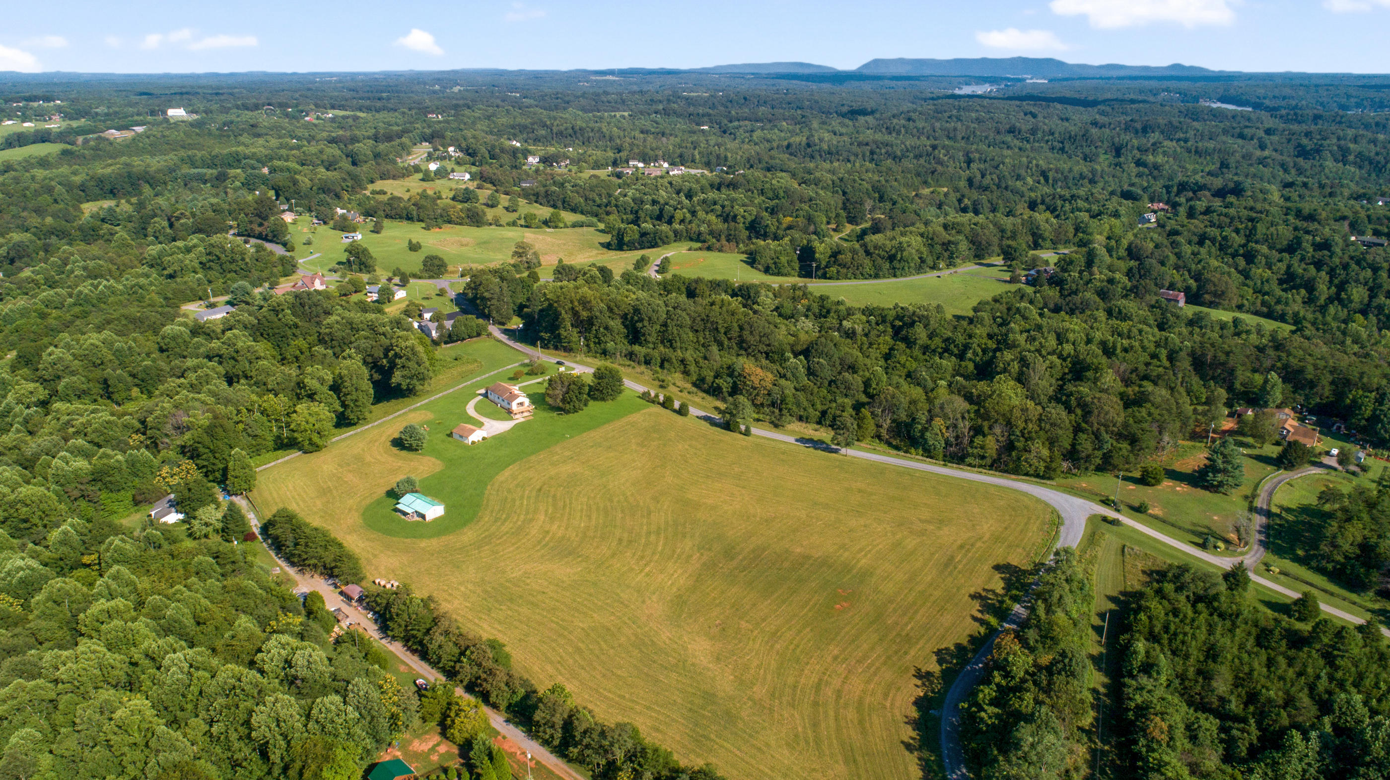 1311 Rock Spring Road Goodview, VA 24095 - Photo 44 of 54 an aerial view of a house with a yard