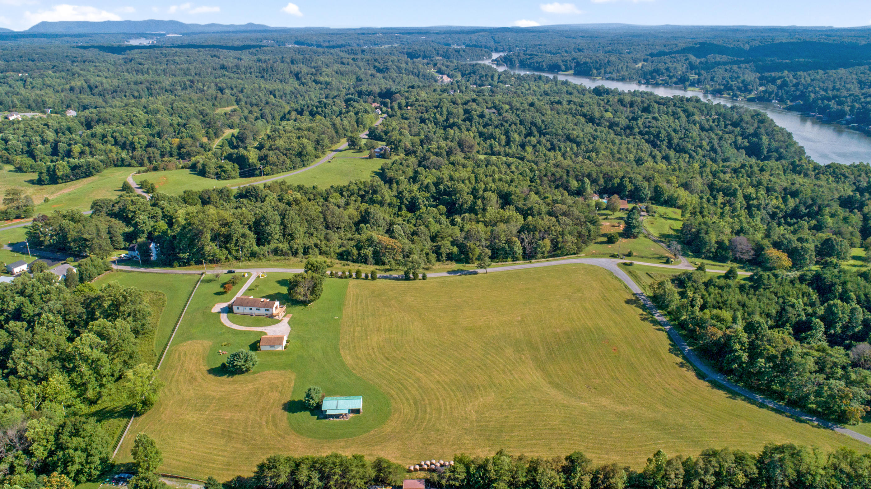 1311 Rock Spring Road Goodview, VA 24095 - Photo 45 of 54 an aerial view of a residential houses with outdoor space and street view