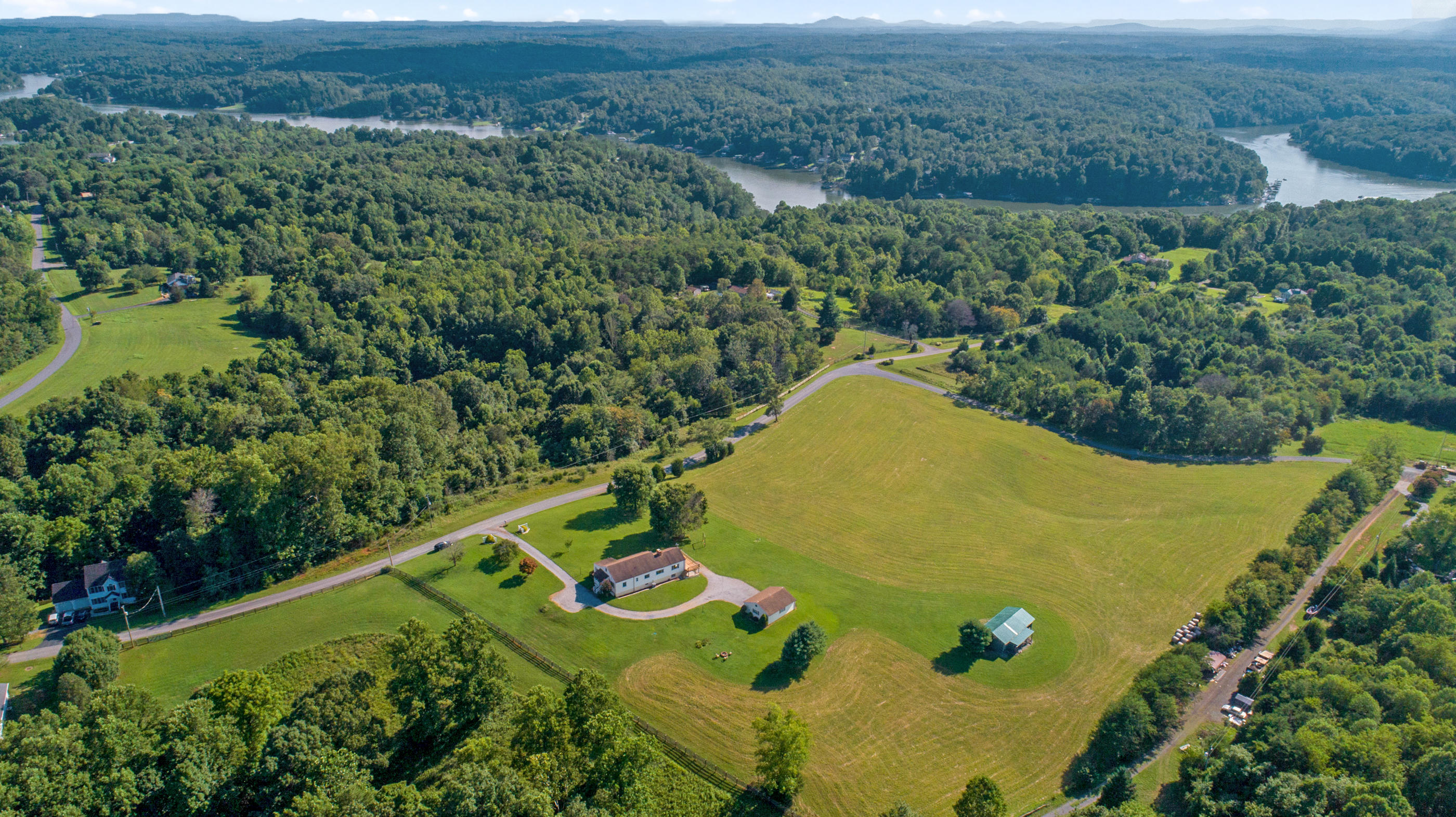 1311 Rock Spring Road Goodview, VA 24095 - Photo 46 of 54 an aerial view of a swimming pool and mountain view