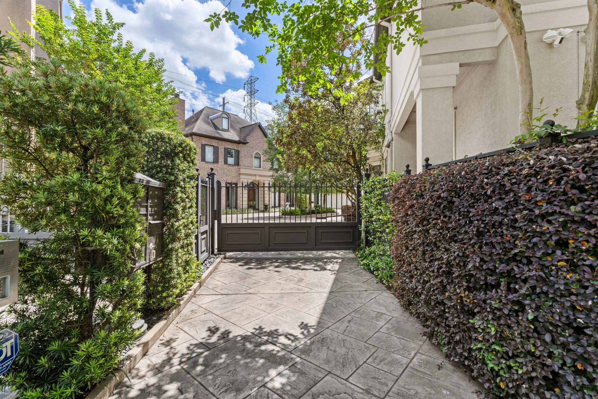 30 Hackberry Lane, Unit A Houston, TX 77027 - Photo 41 of 42 Wrought-iron driveway gate.