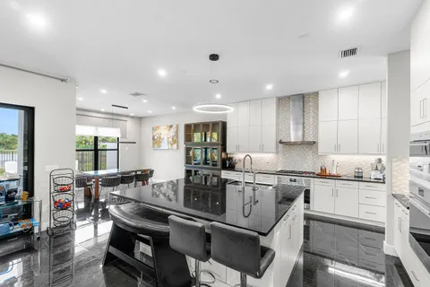 a kitchen with counter top space cabinets and stainless steel appliances