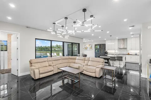 a bathroom with a granite countertop sink mirror and toilet