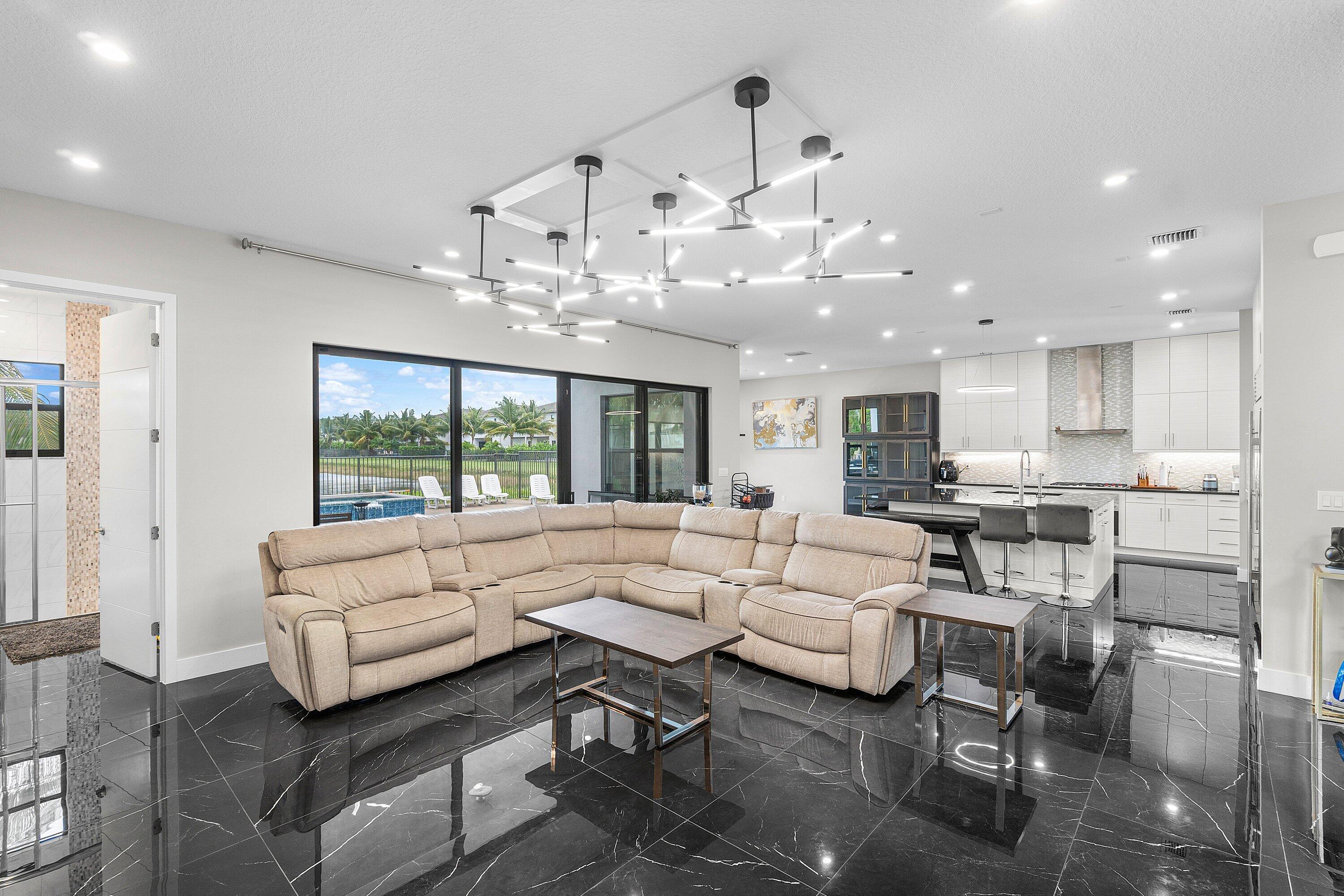 17238 Teton River Road Boca Raton, FL 33496 - Photo 19 of 67 a living room with furniture kitchen view and a large window
