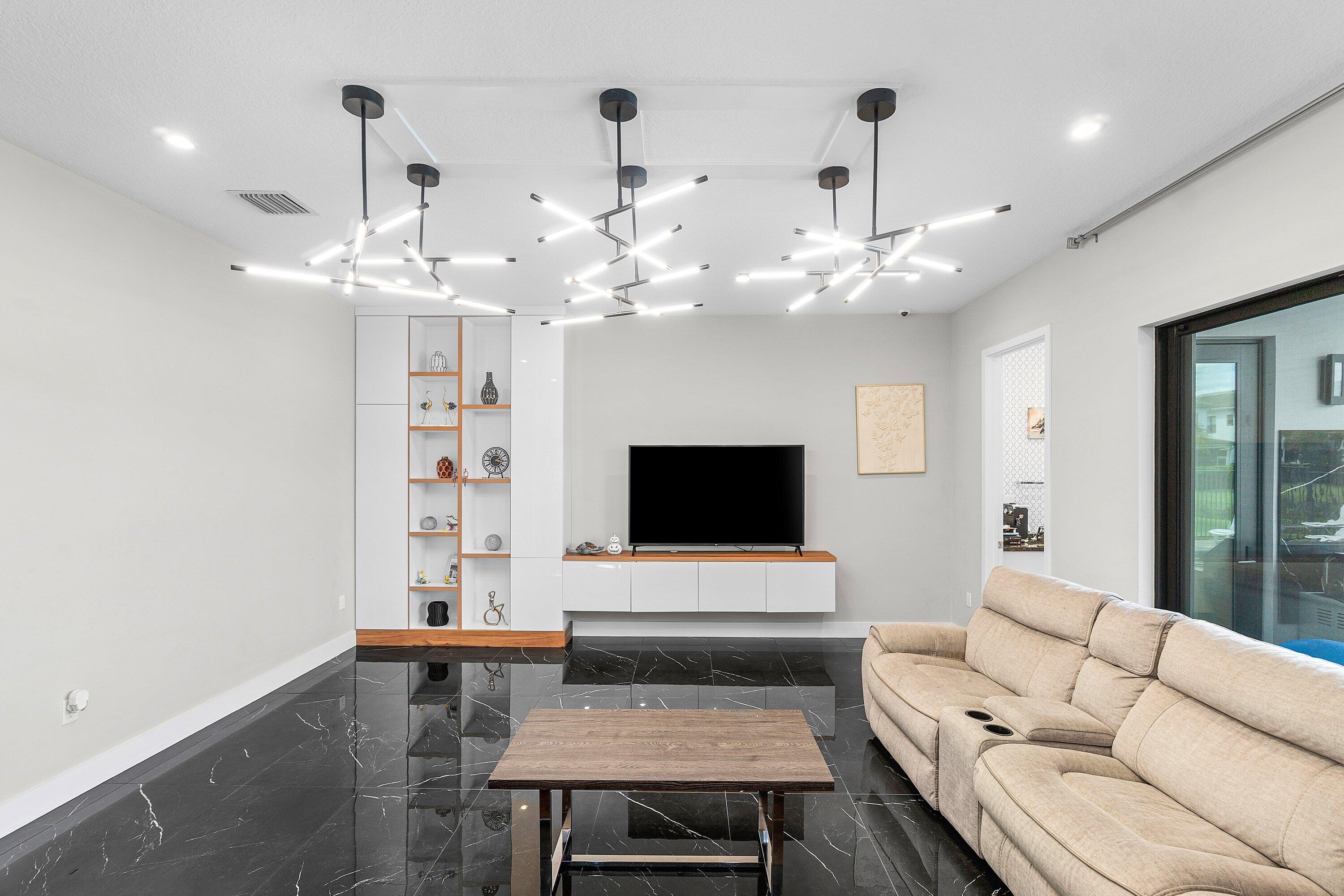 17238 Teton River Road Boca Raton, FL 33496 - Photo 20 of 67 a living room with furniture and a flat screen tv