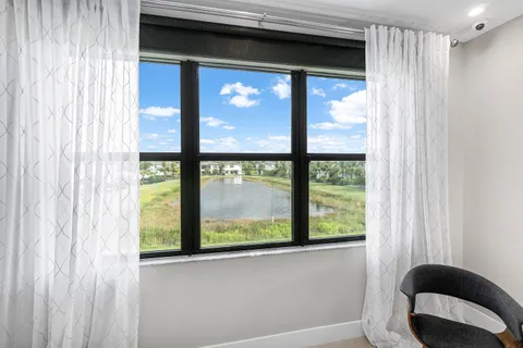 a spacious bathroom with a double vanity sink a mirror and a bathtub