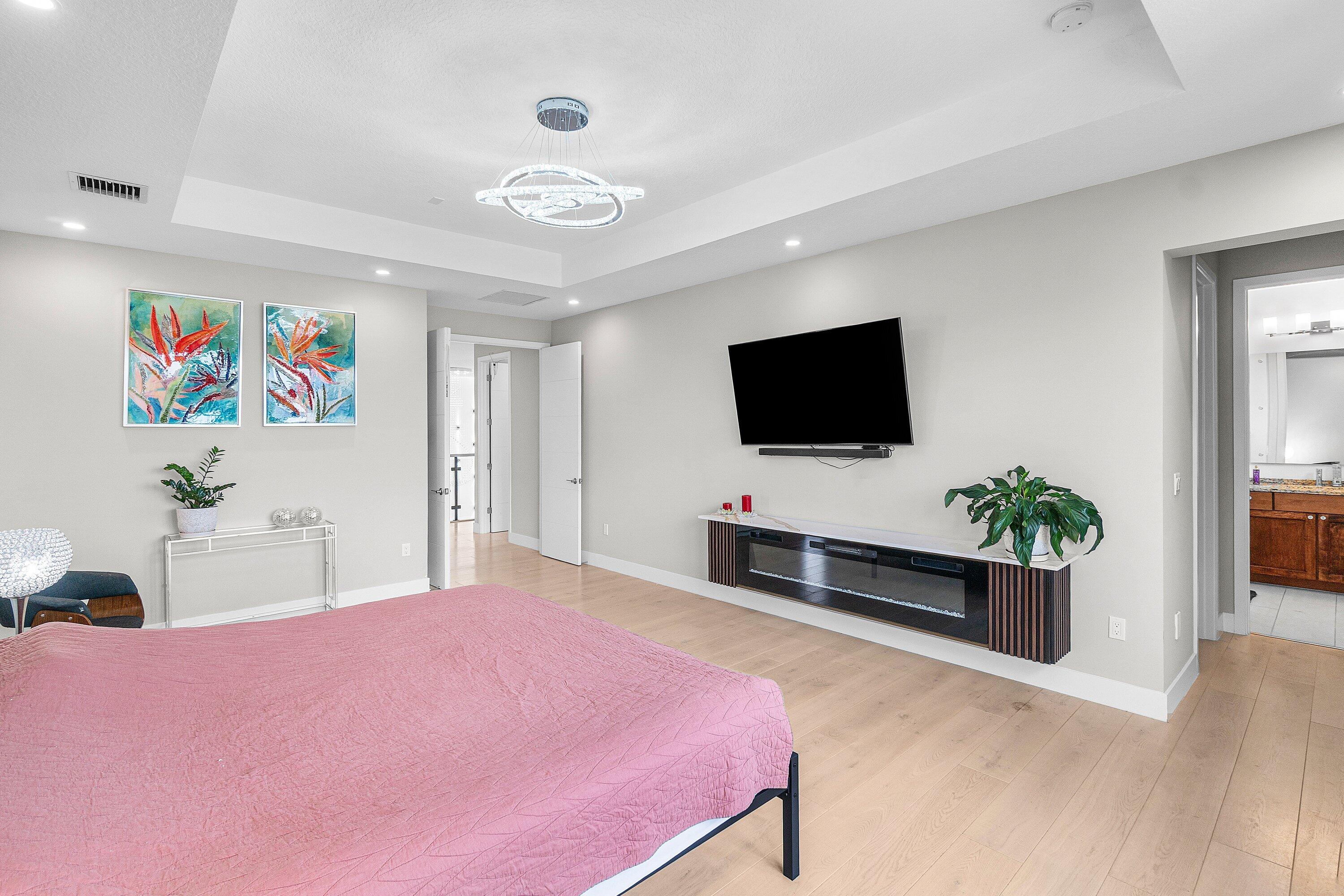 17238 Teton River Road Boca Raton, FL 33496 - Photo 27 of 67 a bedroom with a bed and a flat screen tv